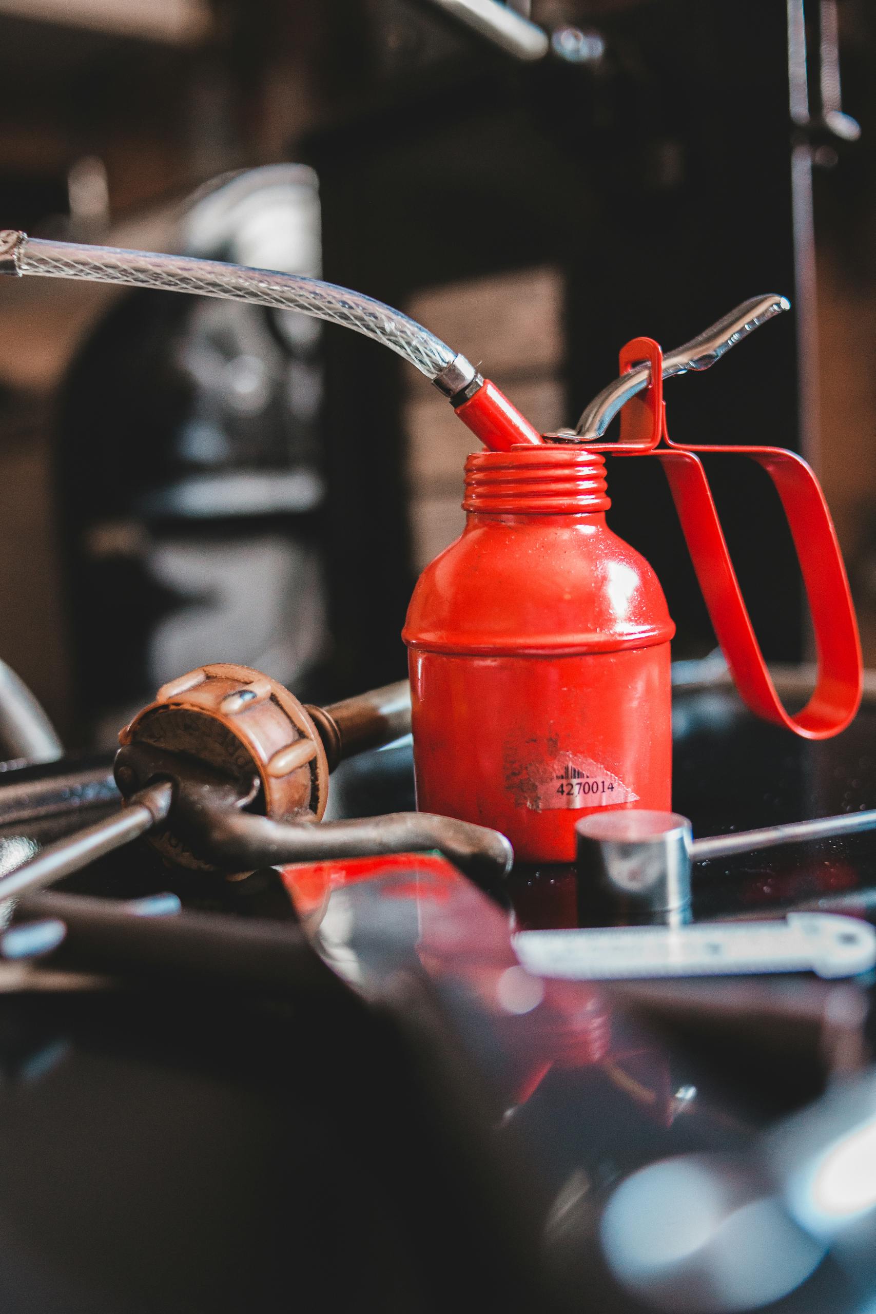 Collection of instruments and ink bottle with pipe placed on table in modern typography